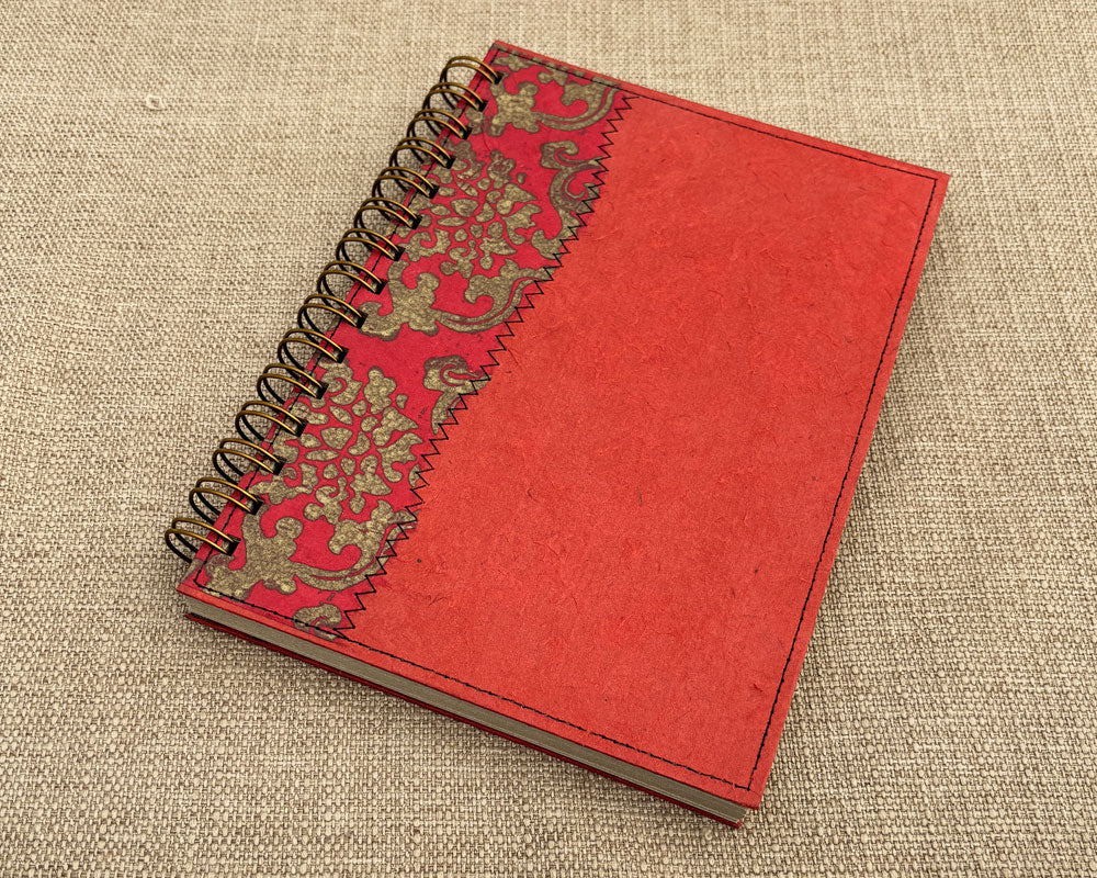 A5 handmade notebook with bold red cover and recycled pages