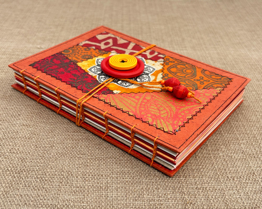 hand stitched journal with red and orange patchwork cover