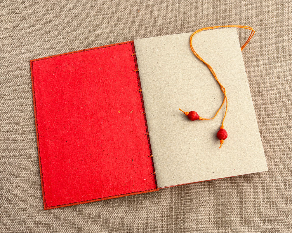 inside cover of red hand bound journal