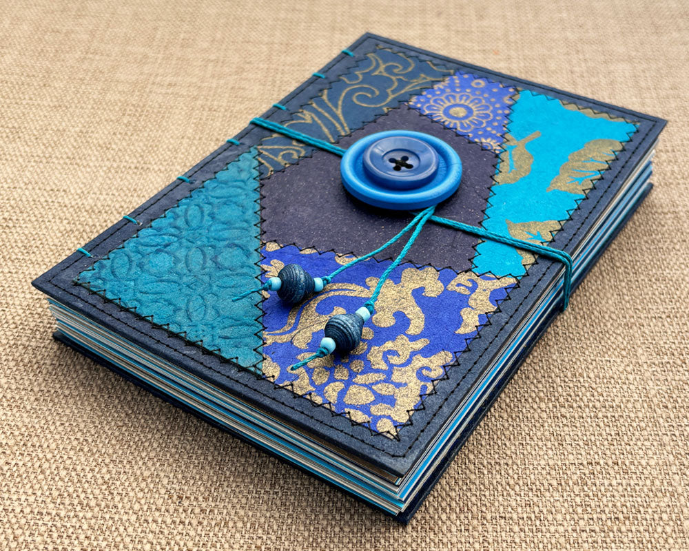 handmade coptic bound journal with blue patchwork cover