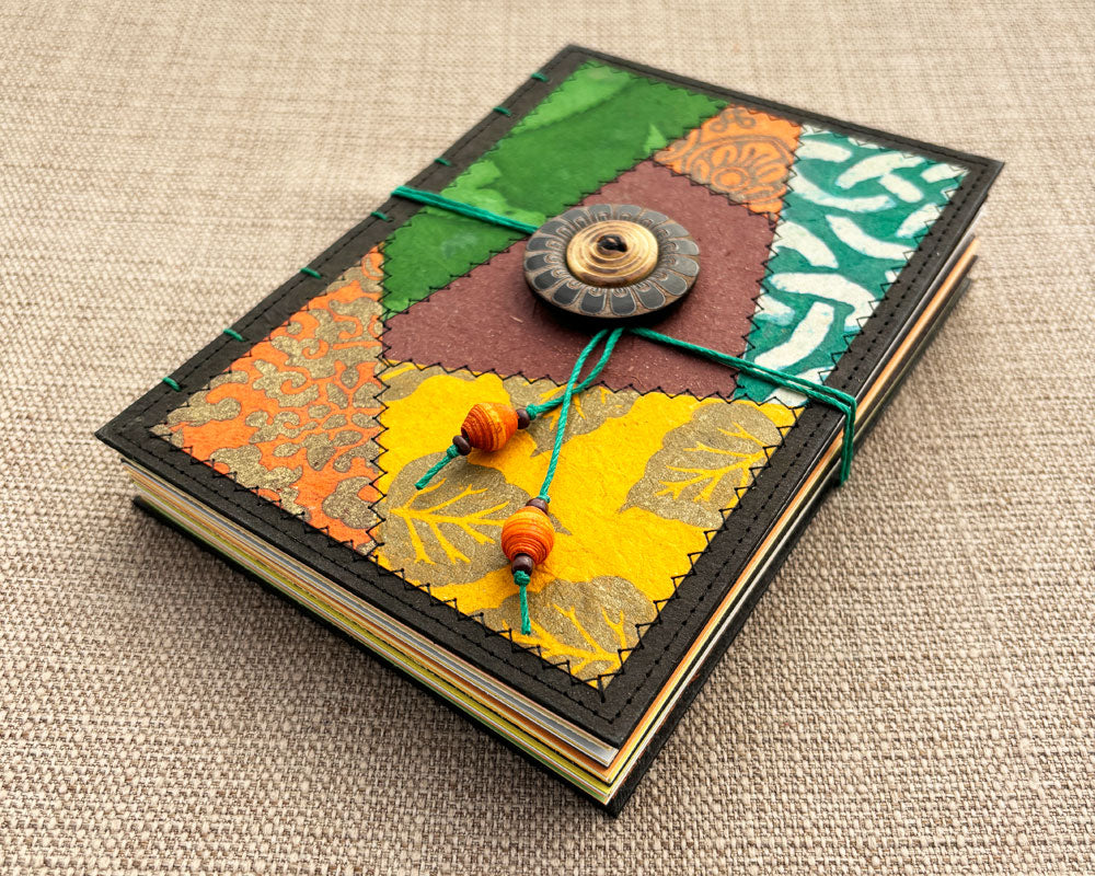 hand stitched journal with patchwork cover in autumnal tones