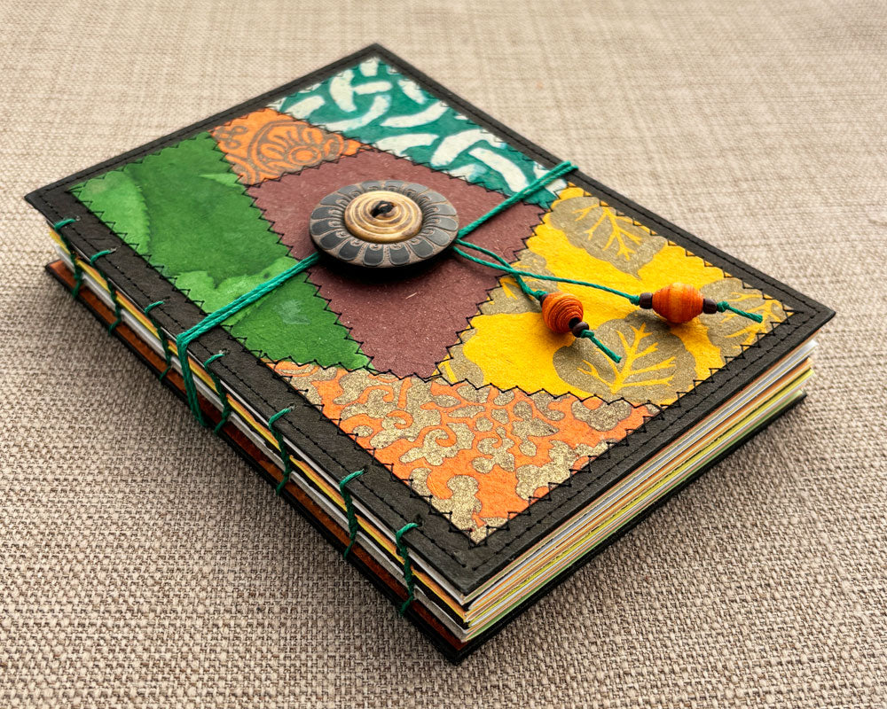 hand bound journal with patchwork cover in earthy tones