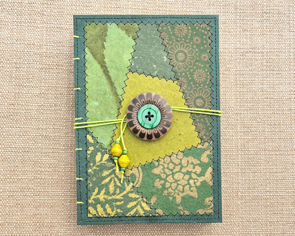 front cover of hand bound journal with green patchwork design