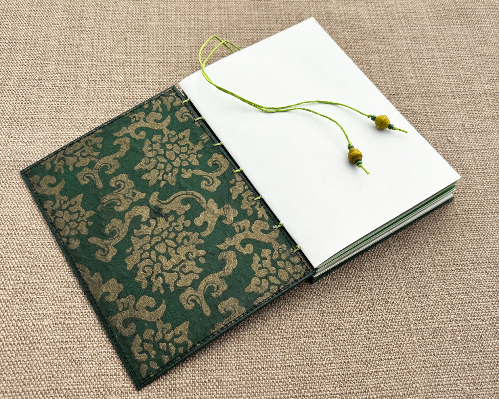 inside green cover of hand stitched journal