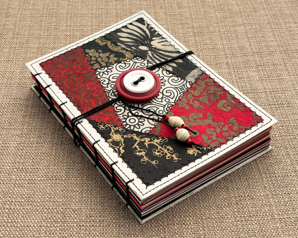 hand stitched journal with red black and white patchwork cover design