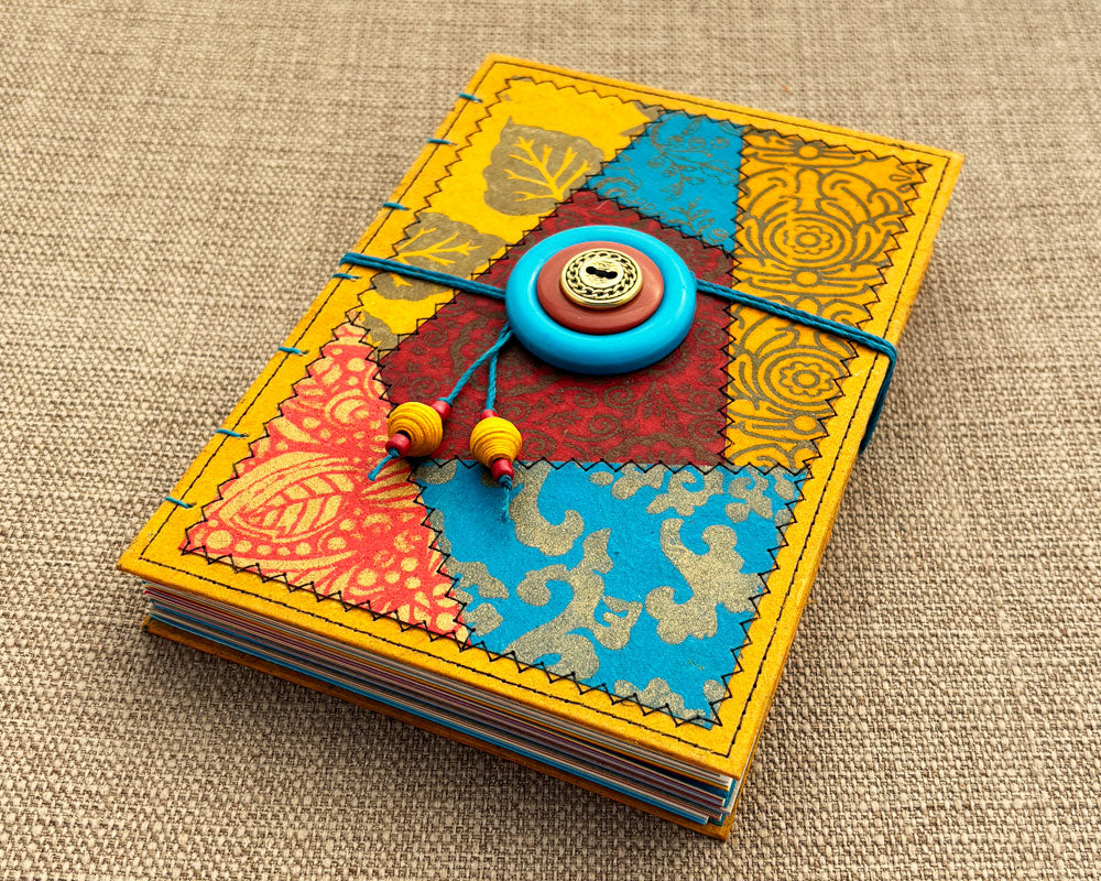 hand stitched journal with red gold and turuoise patchwork cover design