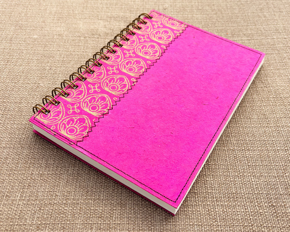 handmade spiral notebook with pink cover featuring gold lotus flower design