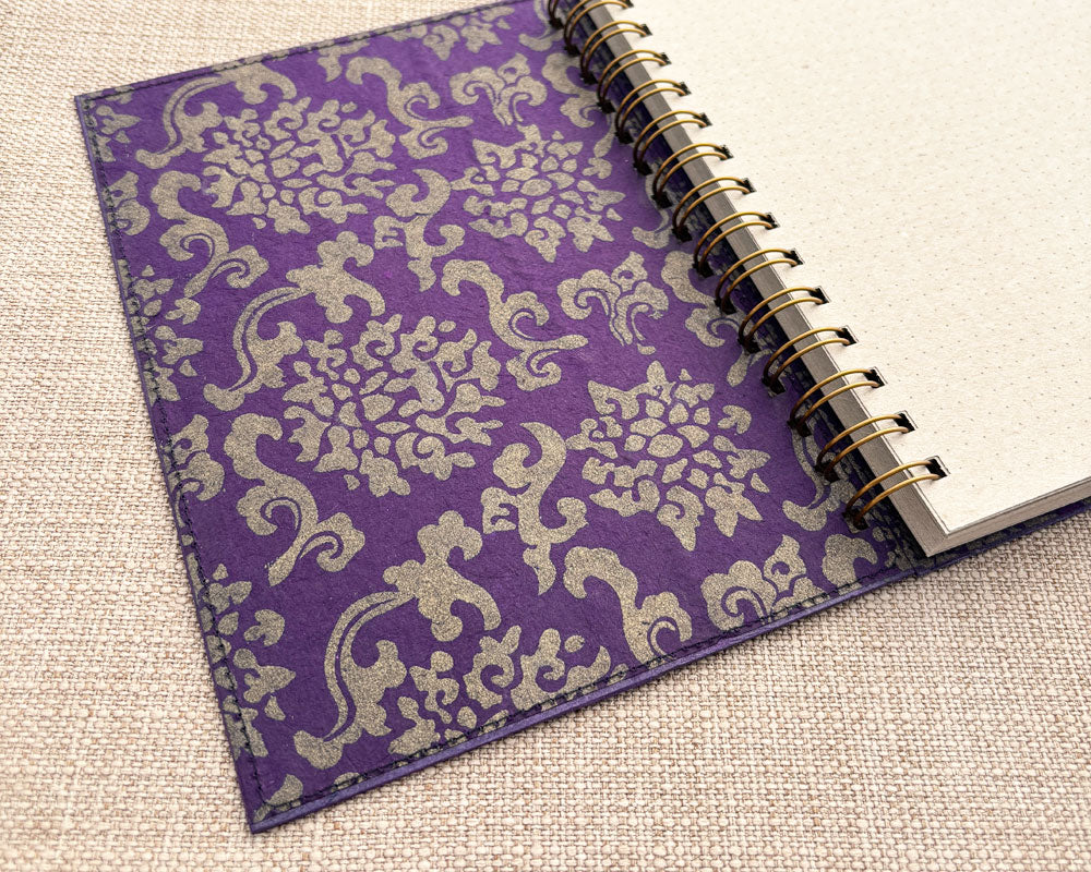 inside purple and gold cover of handmade spiral notebook